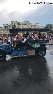 Characters riding in the rainy day cavalcade at the Magic Kingdom on a rainy day.